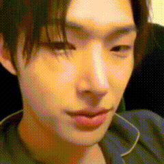 a close up of a young man 's face with a polka dot pattern .