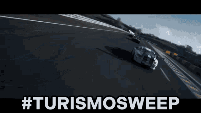 a car is driving down a race track with the hashtag #turismosweep written below it