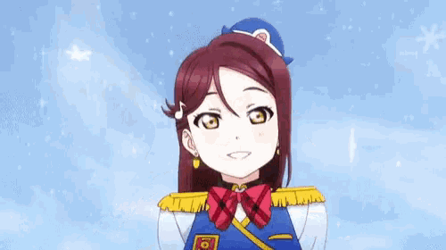 a close up of a girl in a blue uniform with a red bow tie .