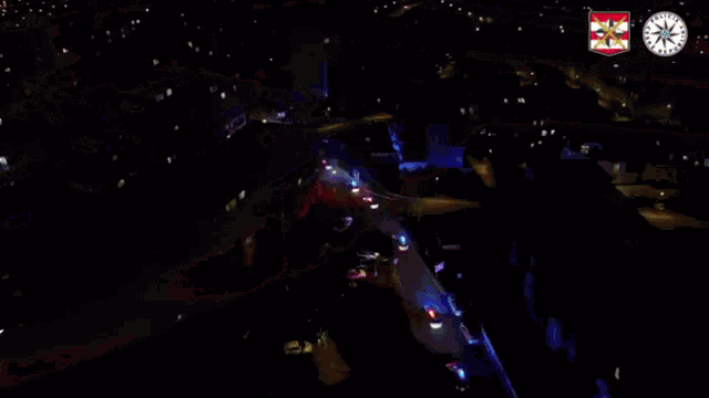 a red and blue light with a clock on the right