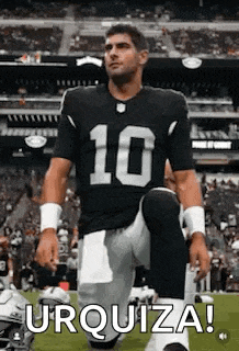 a football player is kneeling down on the field .