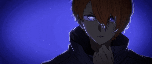 a man with red hair and blue eyes is looking at the camera