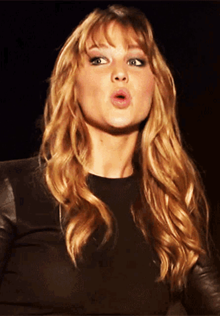 a woman making a funny face with her mouth wide open