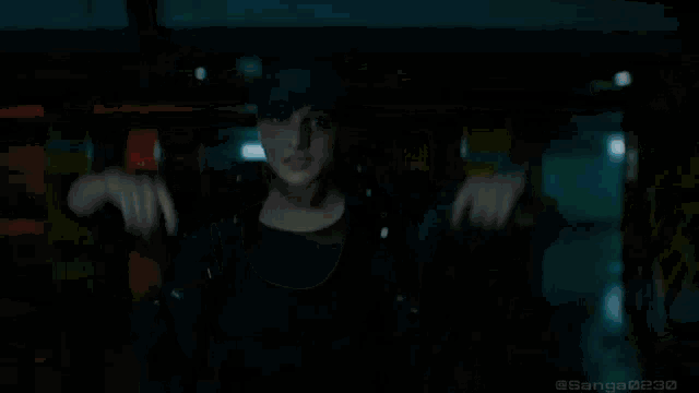 a woman in a hat is pointing a gun at something