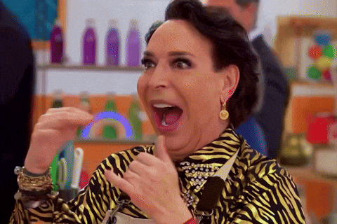 a woman in a zebra print shirt is making a surprised face