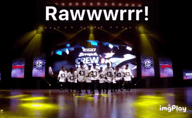 a group of people dancing on a stage with the words rawwwrrr on the top