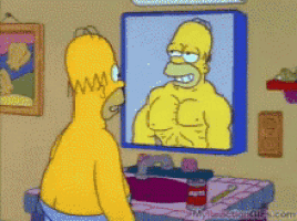 homer simpson is looking at himself in a mirror