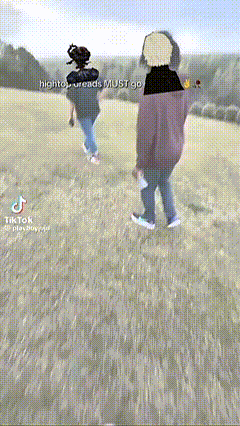 two people are walking in a field with the words hightop dreads must go on the bottom