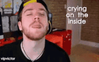 a man is crying on the inside while wearing headphones .