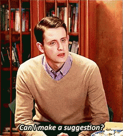 a man is sitting at a table and says " can i make a suggestion ? "