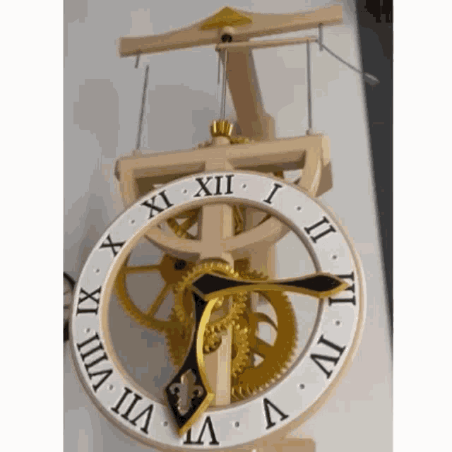 a wooden clock with roman numerals including xii ii iii and iv