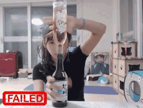 a woman is holding a bottle of wine with a failed stamp on the bottom