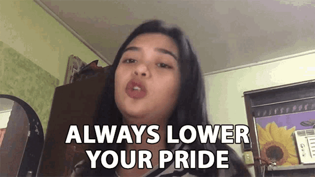 a woman says " always lower your pride " in front of a picture of a sunflower