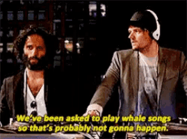 two men are talking about whale songs and one of them says we 've been asked to play whale songs