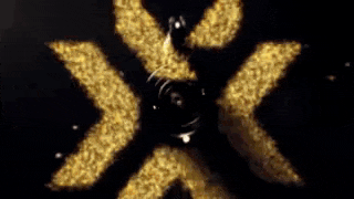 a bullet is flying through the air in front of a flame .