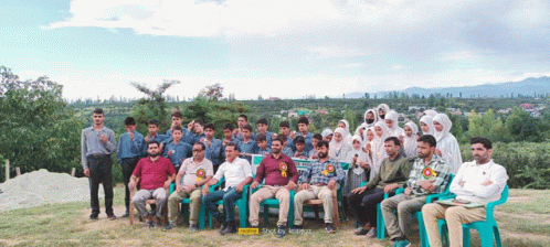 a group of people posing for a picture with the word realme on the bottom