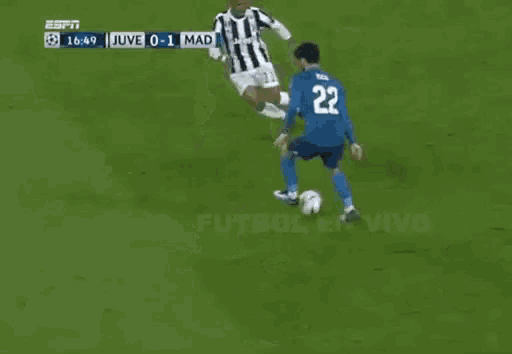 a soccer player with the number 22 on his back kicks the ball