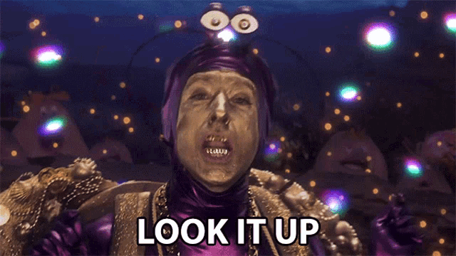 a man in a purple and gold costume says " look it up "