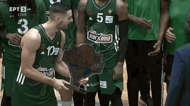 a group of basketball players are posing for a photo and one of them has the number 3 on his jersey