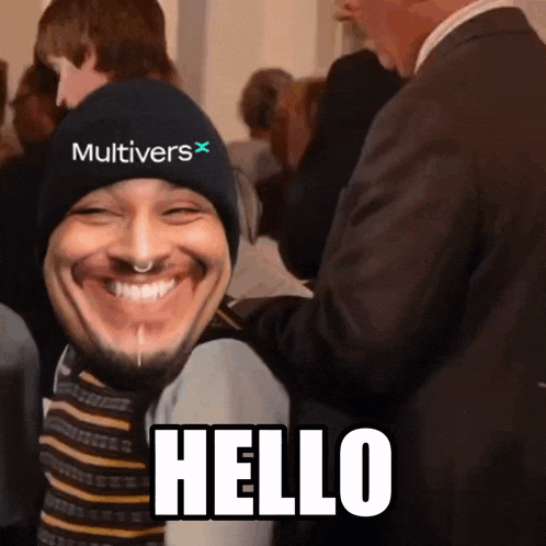 a man wearing a hat that says multivers is smiling