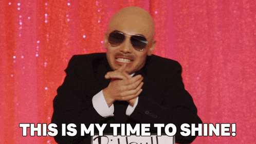 a man wearing sunglasses and a suit says this is my time to shine