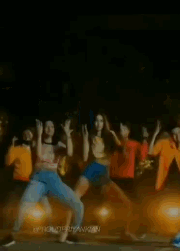 a man in a new york jersey is dancing with his arms in the air