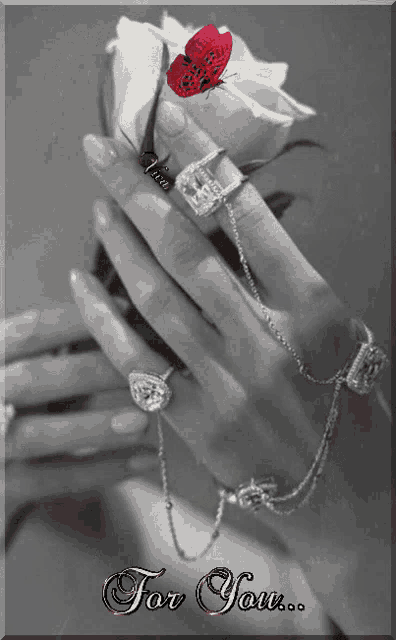 a black and white photo of a woman holding a rose with the words for you written below