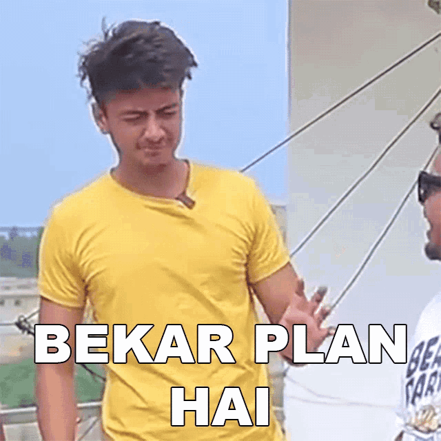 a man in a yellow shirt is standing next to another man with the words " bekar plan hai " on the bottom