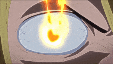 a close up of a person 's eye with a glowing flame in it