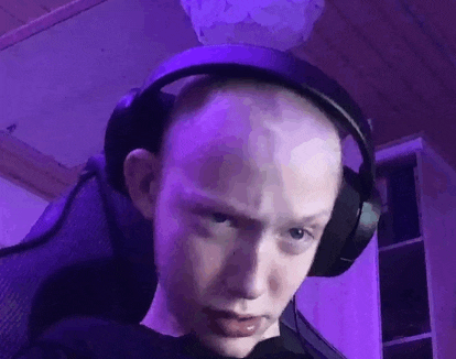 a close up of a person wearing headphones .