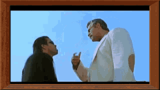 two men are standing next to each other in a picture frame with a blue sky in the background