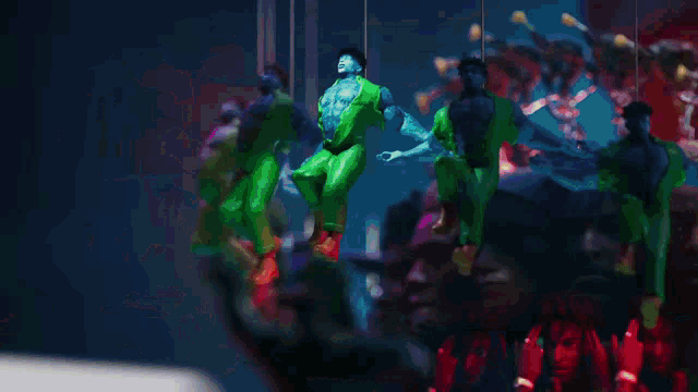 a blurred image of people dancing in a dark room with a device in the foreground that says ' 4k '