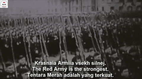 a black and white photo of a red army marching in a line