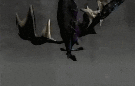 a black and purple dragon is flying through the air in a dark room .
