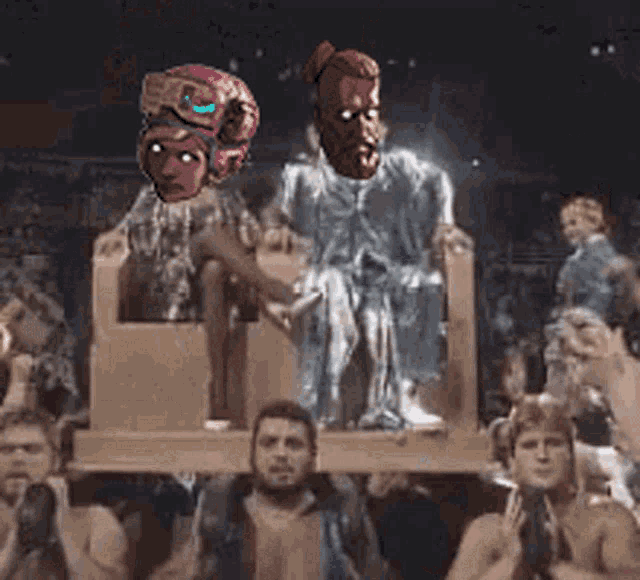 a group of people are standing around a cardboard box with a statue on it