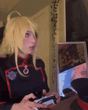 a woman playing a video game with a female symbol on her uniform