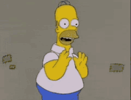 homer simpson is standing with his mouth open