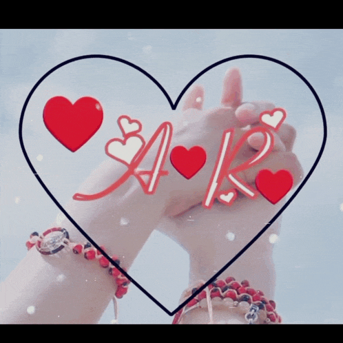 a couple holding hands inside of a heart with the letter a and k
