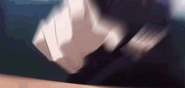a close up of a person 's fist being punched in the face .