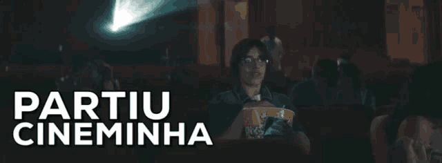 a woman is holding a bucket of popcorn while watching a movie with the words partiu cineminha written above her