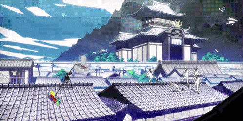 a group of people standing on top of a roof in front of a building