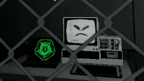 a computer with an angry face on the screen