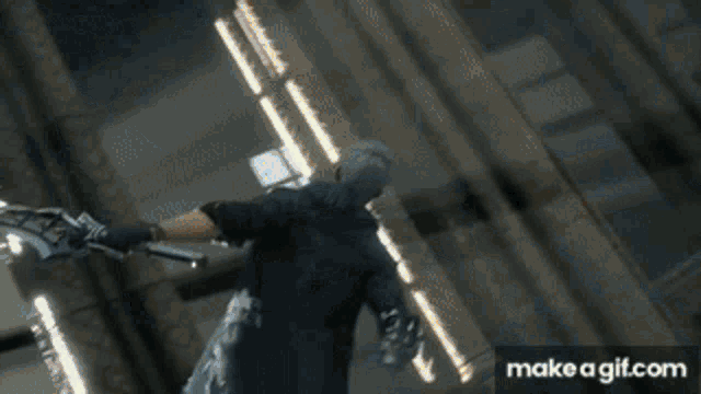 a person is holding a sword in front of a door that is open and a fire is coming out of it
