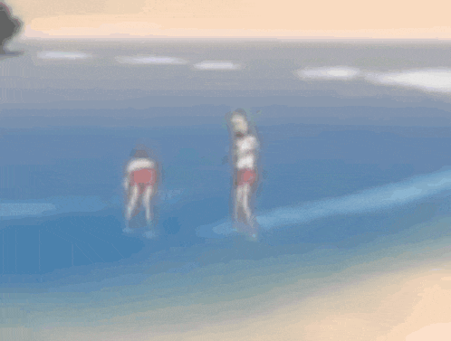 a blurry picture of two people playing in a pool