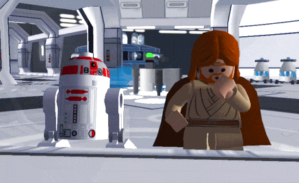 a lego star wars character stands next to a r2d2