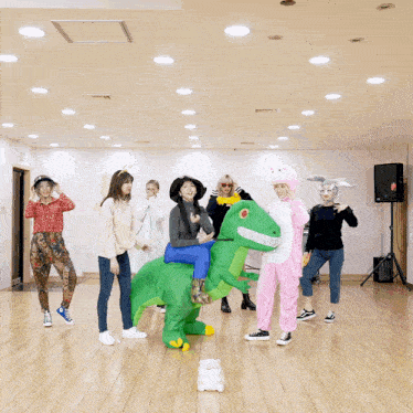 a group of people dressed up in costumes including a dinosaur