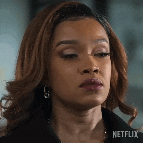 a close up of a woman 's face with the word netflix on the bottom
