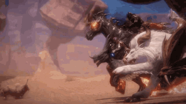 a group of monsters are fighting each other in a desert .
