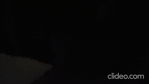 a cartoon drawing of a monster with glowing eyes and the words clideo.com at the bottom