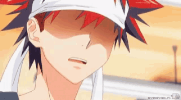 a close up of a person 's face with a bandana around their head
